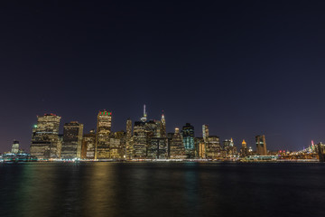 Fototapete - Manhattan skyline panorama with Times Square lights at dusk, New York City