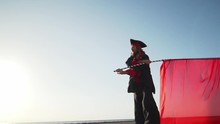 Acrobat Pirate On Stilts Make Show With Red Flag Shaky Footage Slow Motion