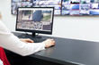 © wellphoto - Surveillance control room operator at work