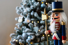 Nutcracker With Christmas Scene In Background