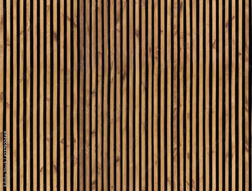 Photo Seamless pattern of modern wall paneling with vertical wooden slats for background