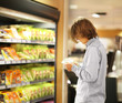 © lado2016 - Teenager shopping in supermarket, reading product information