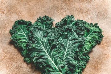 Wall Mural - Top view on a kale leaves. The concept of healthy and vegetarian food.