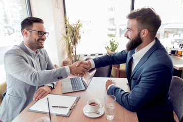 Business people shaking hands