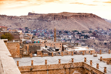 Wall Mural - Beautiful Mardin old city landscape from Minaret of the Great Mosque. It known also as Ulu Cami. Old minaret with mesopotamian plain in the background in Turkey