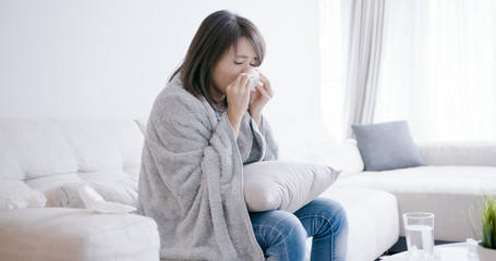 woman sick and sneeze