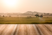 Empty Wooden Table Ricefield And Sunrise Background