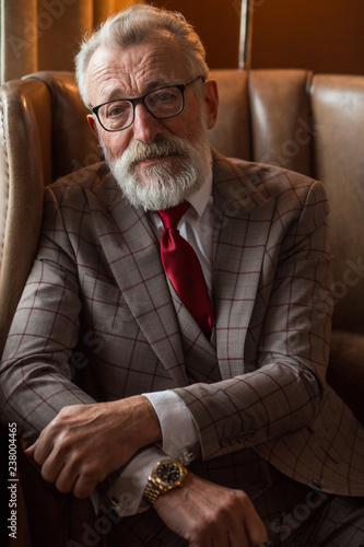 Portrait Of Whitebeard Male With Short Grey Haircut Dressed In