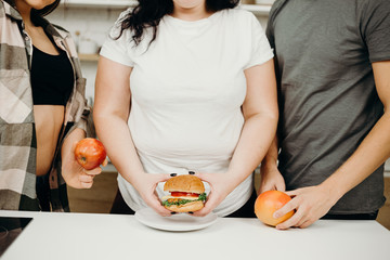 Wall Mural - obesity prevention, conscious eating, nutrition choices, mindfulness and healthy lifestyle. group of people with junk and proper food.