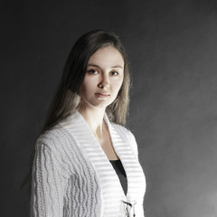 Wall Mural - contemporary young woman on a black background.