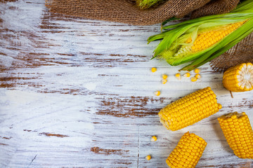 Wall Mural - Ripe corn on a wooden table