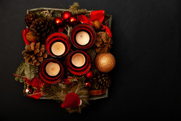 Top view of Advent wreath on black background with some copy space
