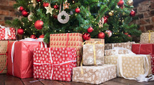 Christmas Gifts Under The Christmas Tree Red And Wooden Toys Brick Wall. New Year 2019