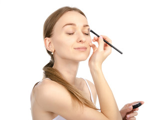 Wall Mural - Beautiful woman beauty fashion eyeshadow brush in hand on white background isolation