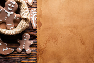 Poster - Blank paper sheet and Christmas cookies on wooden table