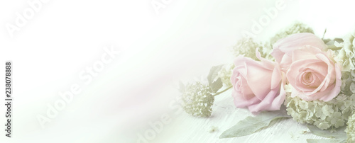 Beautiful rose flowers on wooden background © Floydine