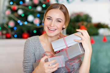 Canvas Print - Cheerful female with Christmas gifts