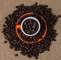 Brown roasted coffee beans, seed on dark background. Espresso dark, aroma, black caffeine drink. Closeup isolated energy mocha, cappuccino ingredient.