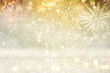 © tomertu - abstract gold glitter background with fireworks. christmas eve, new year and 4th of july holiday concept.