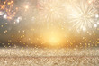 Leinwandbild Motiv abstract gold glitter background with fireworks. christmas eve, new year and 4th of july holiday concept.