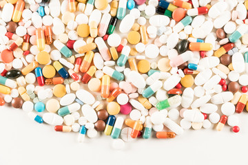 Wall Mural - High number of pills on white background surface. High resolution image for pharmaceutical industry.