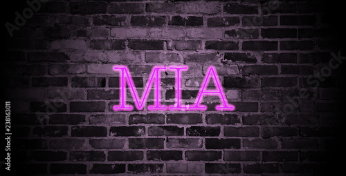 Fotomural first name Mia in pink neon on brick wall