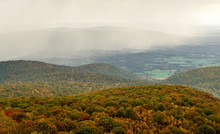 Fall Color Forest And Rolling Hills And Valleys In The Appalachians Of Virginia With Rain And Clouds In The Distance