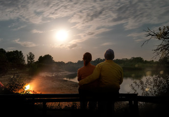 Wall Mural - couple camping with campfire and tent outdoors