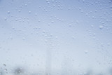 Fototapeta Tęcza - Droplets of Water on Window