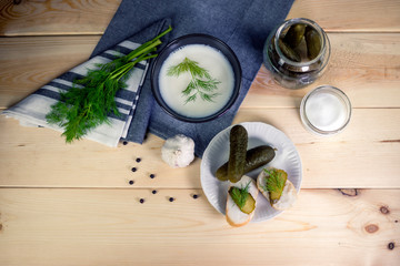 Fresh bread with lard and pickled cucumbers