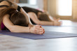 © uv_group - Young women in yoga class, meditation, doing stretching exercises. Hero yoga pose for relaxation. Healthy lifestyle