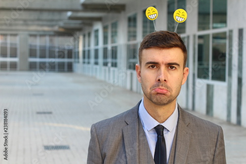 Valokuva Capricious businessman feeling moody at work