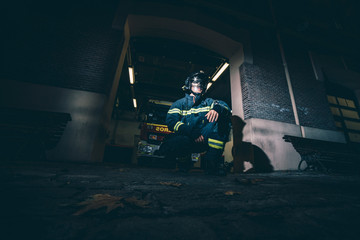 Wall Mural - Fireman posing in front of the station.