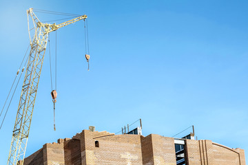 construction crane on blue sky background