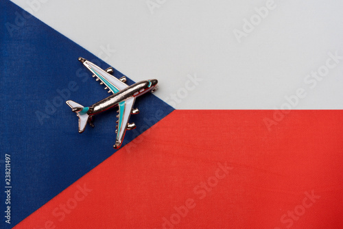 Photo The plane over the flag of the Czech Republic, the concept of travel