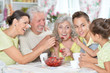 © aletia2011 - Portrait of big happy family eating fresh strawberries