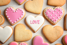 Decorated Heart Shaped Cookies On Color Background, Top View. Valentine's Day Treat