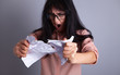 © SZ Photos - businesswoman tear paper angry screaming