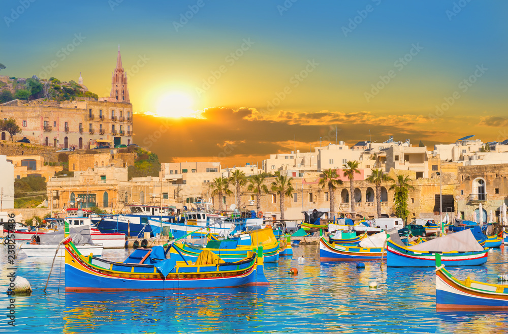 Marsaxlokk village harbor of Malta, illuminate by sunset light - obrazy, fototapety, plakaty 
