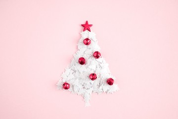 Wall Mural - Christmas creative minimal composition. Xmas white tree made of sparkles confetti on pastel pink background. Christmas, New Year, winter concept. Flat lay, top view, copy space