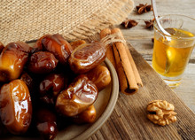 Dry Dates In A Plate On A Wooden Background