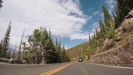 Wall Mural - Driving on paved road in Rocky Mountain National Park.