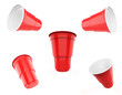 © Designkida - Red plastic party cups set, isolated on white background. 3d illustration