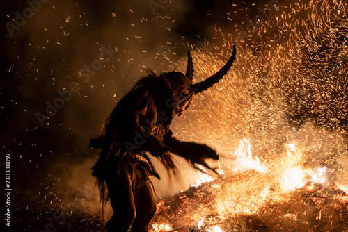 Fotomural The Krampus masks in an exhibition in the night in Tarvisio, Italy