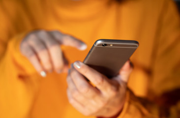 woman using mobile close up conceptual image of phone addiction mobile gaming and social media