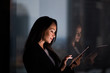 © ReeldealHD images - Businesswoman and reflection working late using digital tablet