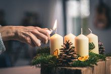 Lighting A Candle On Advent Wreath