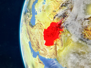  Afghanistan from space on model of planet Earth with country borders and very detailed planet surface and clouds.