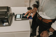 © ADDICTIVE STOCK - Crop black hand inserting password on payment terminal