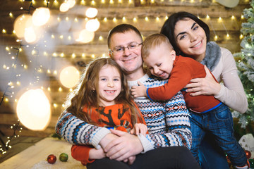 Canvas Print - happy hugging family in christmas house